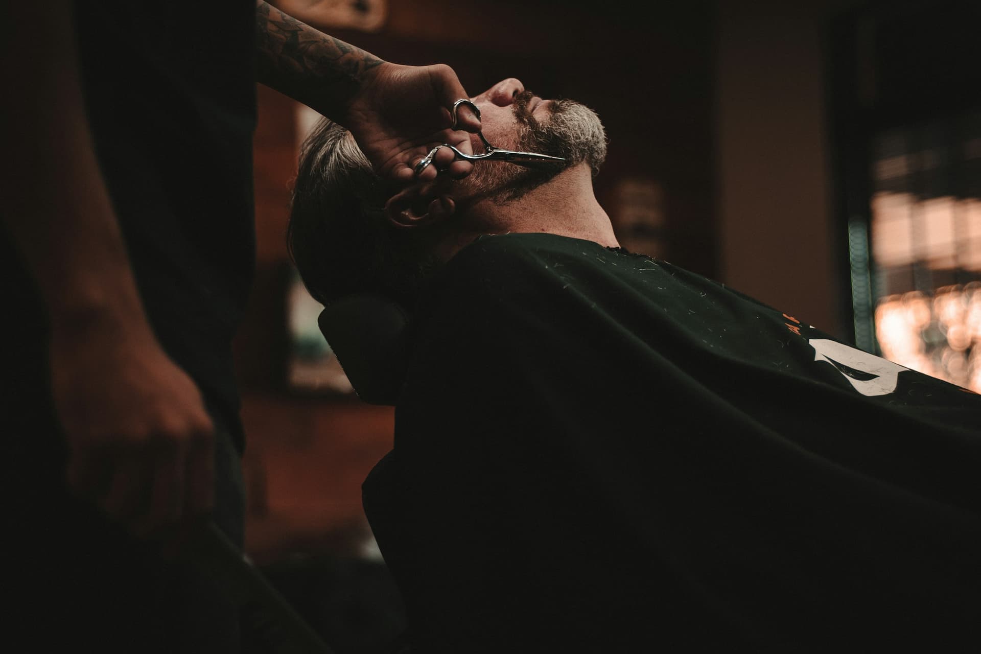 Barber detailing edge-up and beard line